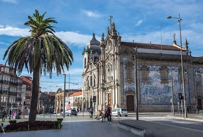 The facade of a nave of the Igreja do Carmo Church is designed with painted azulejo tiles.