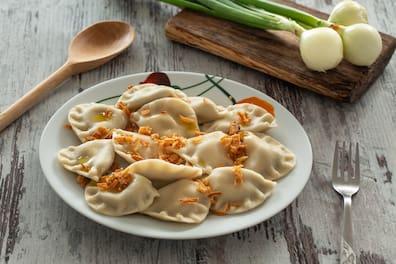 Dumplings on a plate, onion