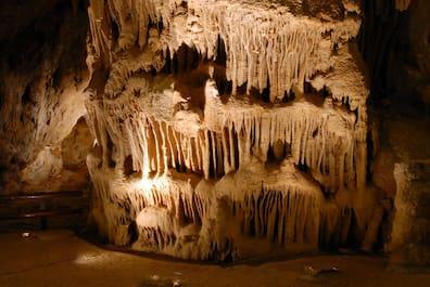 Illuminated stalagmites and stalactites in the Resava Cave in Serbia.