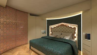 View into a baroque-style bedroom with a large bed.