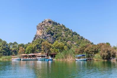 Numerous boats sail through the canals of Dalyan daily, searching for turtles and offering tourists a view of the canals' natural beauty.