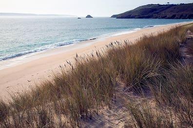 Shell Beach on Herm is primarily composed of finely crushed seashells.