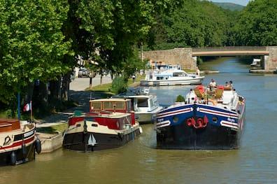 Boats sailing on a canal.