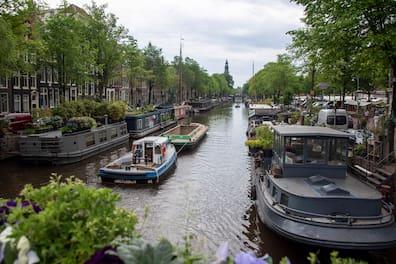 Houseboats in the Prinsengracht, Westerkerk in Amsterdam.
