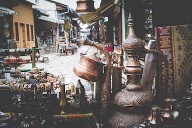 A vendor on the main square of Sarajevo offers oriental souvenirs for sale