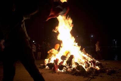 Traditional burning of cardboard figures in a fire in Ecuador.