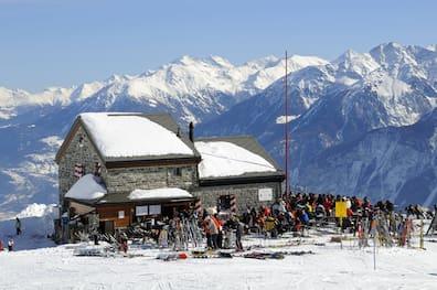 Alpine hut on a snowy mountain in Crans Montana