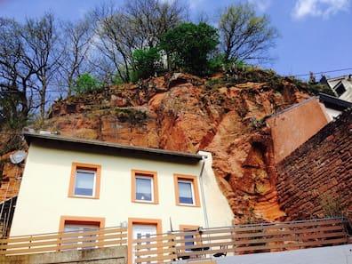In Trier, stay in a house built directly into a rock.