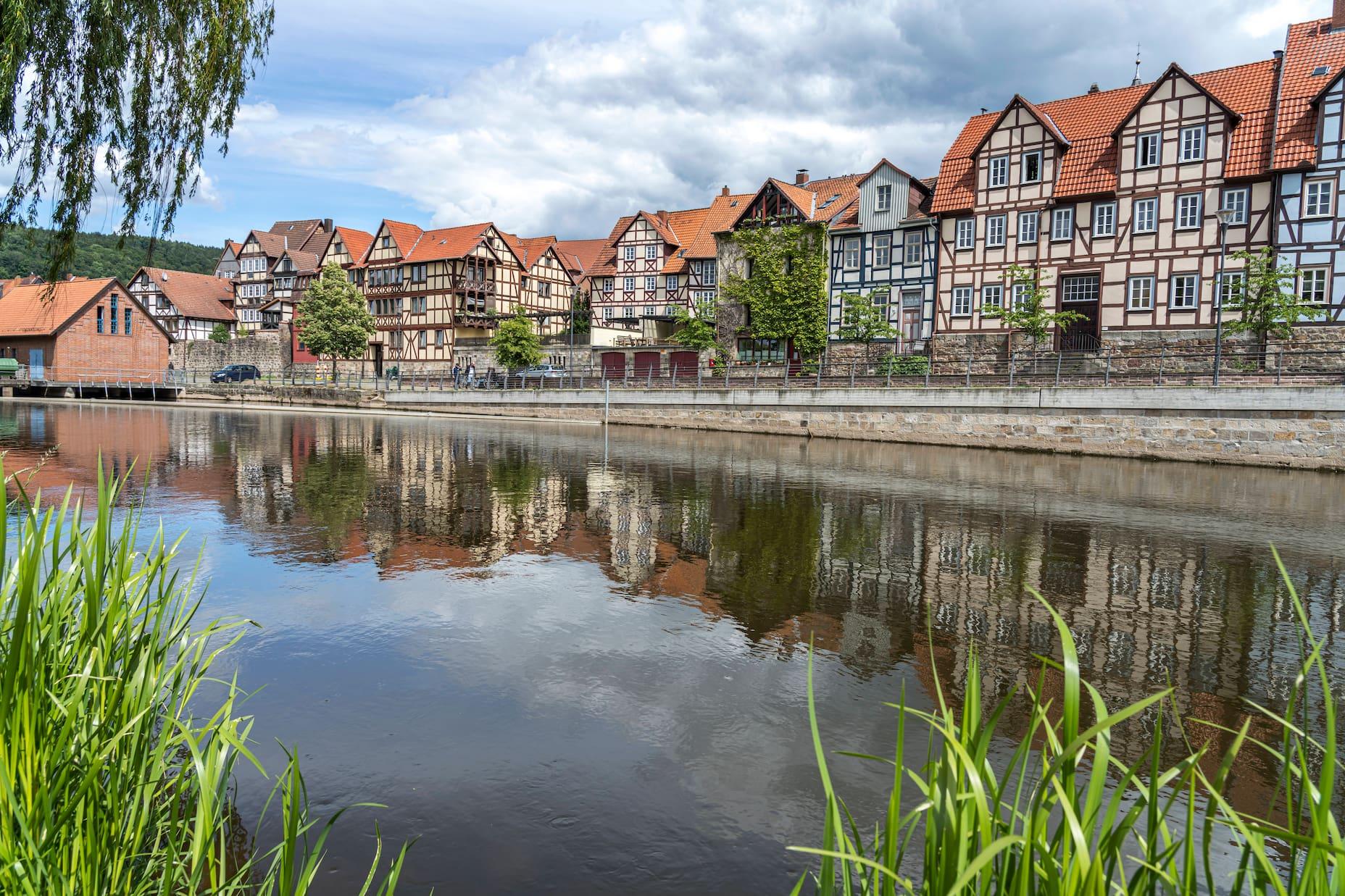 The cityscape of Hannoversch Münden is defined by its forested surroundings and water.