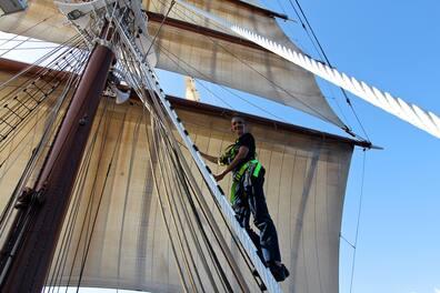 Cadet Nicoletta Sarghe works on the mast of the Sea Cloud 180 feet above sea level.