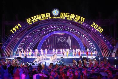 Visitors enjoy themselves during the 30th Qingdao International Beer Festival at the Gold Sand Beach Beer Square.