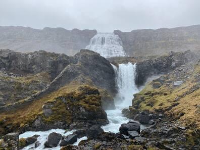The six cascades of Dynjandi waterfall drop from top to bottom to the fjord with a height difference of 500 meters.