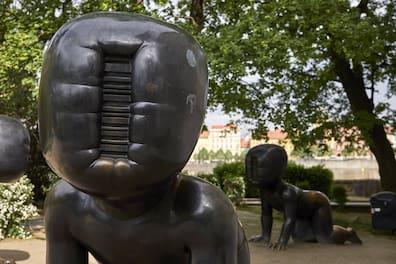 The Miminka by Czech artist David Černý crawling at the entrance to the Kampa Museum.