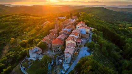 View of the mini-town Hum on a hill at sunset.