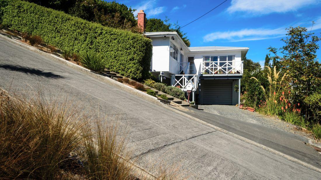 <strong>Baldwin Street:</strong> According to the Guinness Book of World Records, this is the steepest residential street in the world. Your legs will definitely agree.