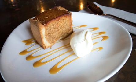 Treacle tart and ice-cream on a plate, at The Cow, Dalbury Lees, UK